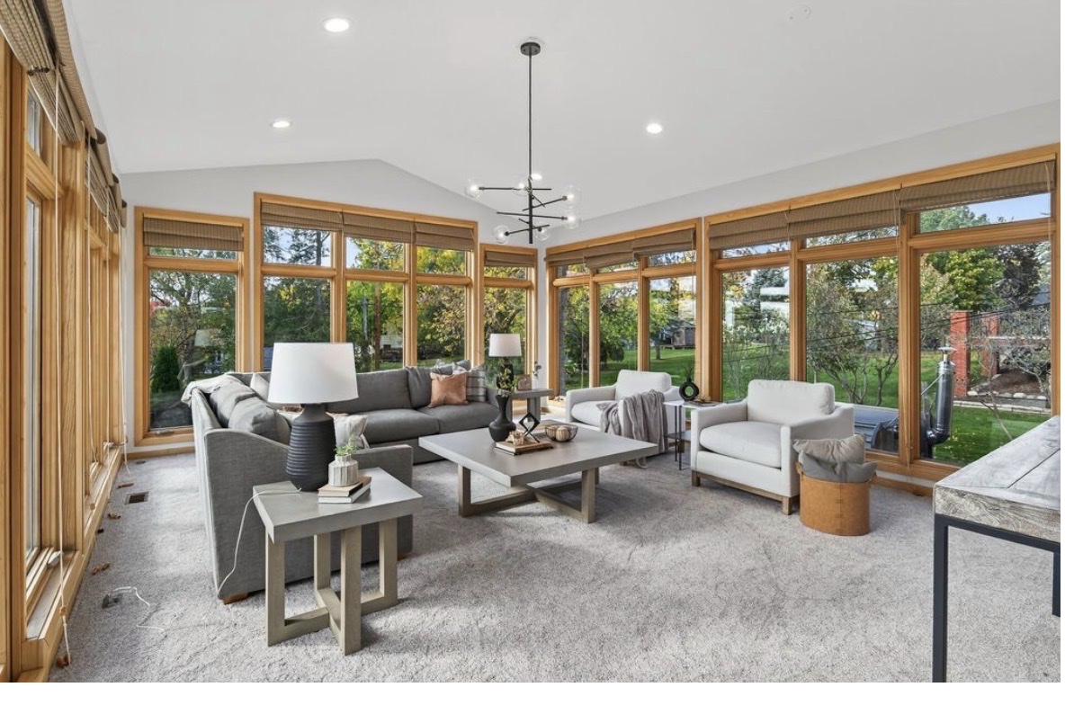 Edina sunroom after — new carpet, floor-to-ceiling windows