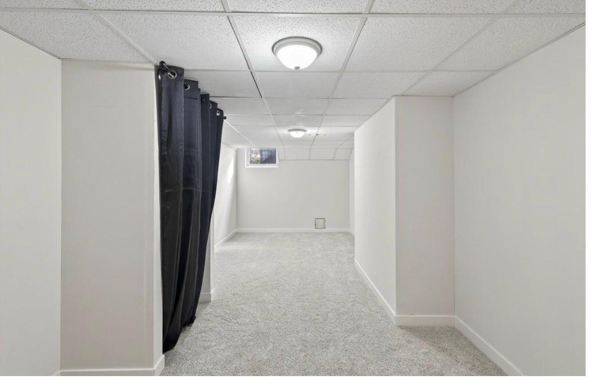 Edina basement room after — new carpet, white walls