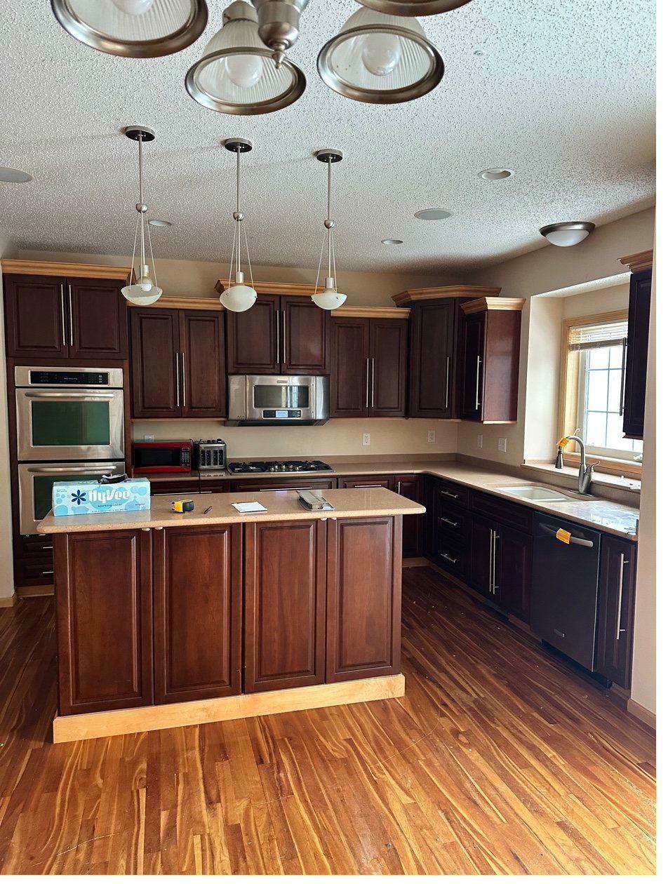 Highland Hills kitchen before — dark espresso cabinets, island