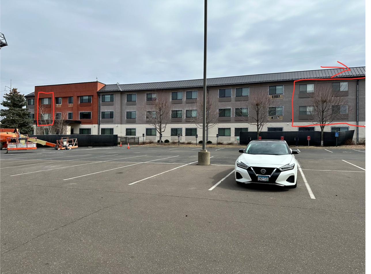 Holiday Inn Express after — stone facade, new entry lighting